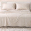 Sofia Home Textiles Printed Bedsheets - Sofia Flower Squares Printed Double Flat Bedsheet Set 4 Pcs (240 × 260 cm) in Beige spread on a double bed - مفروشات صوفيا - ملايات مطبوعة - طقم ملاية صوفيا مربعات ورد دبل مسطحة 4 قطع (240 × 260 سم) باللون بيج مفروش على سرير دبل