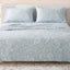 Sofia Home Textiles Printed Bedsheets - Sofia Large Paisley Printed Double Flat Bedsheet Set 4 Pcs (240 × 260 cm) in Light Blue spread on a double bed - مفروشات صوفيا - ملايات مطبوعة - طقم ملاية صوفيا كشمير كبير دبل مسطحة 4 قطع (240 × 260 سم) باللون أزرق فاتح مفروش على سرير دبل