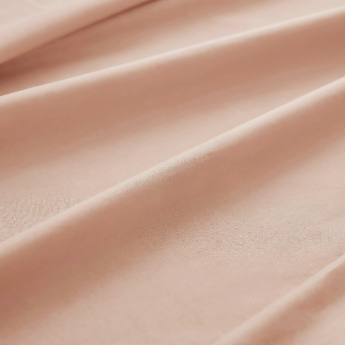 Sofia Home Textiles Bedsheets - 100% microfiber texture of Sofia Single Plain Bedsheet Set 3 Pieces (180 × 240 cm) in Salmon, close-up shot - مفروشات صوفيا - ملايات - ملمس مايكروفايبر 100% في طقم ملاية صوفيا سادة سنجل  3 قطع (180 × 240 سم) باللون سالمون، لقطة مقربة