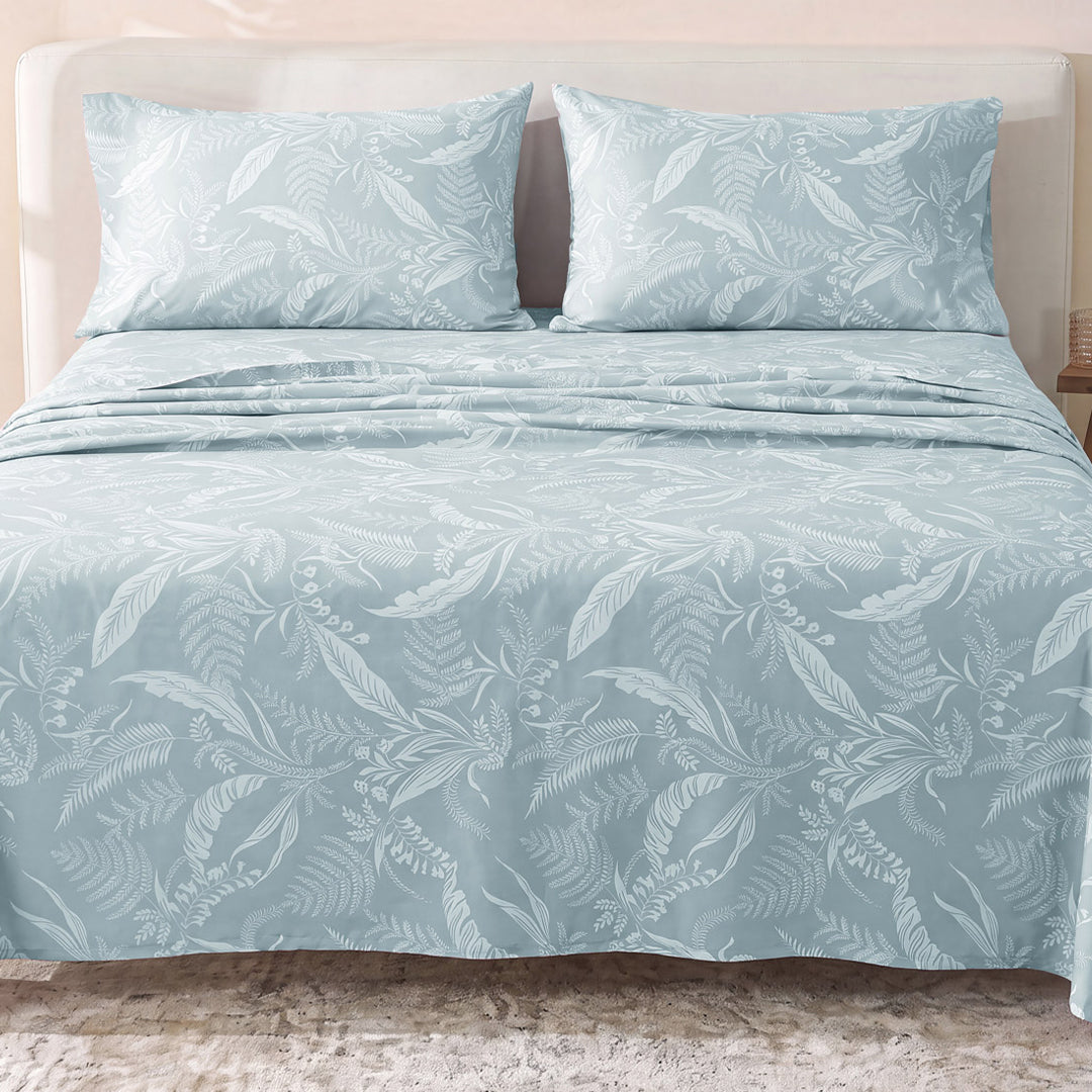 Sofia Home Textiles Printed Bedsheets - Sofia Tree Branches Printed Double Flat Bedsheet Set 4 Pcs (240 × 260 cm) in Light Blue spread on a double bed - مفروشات صوفيا - ملايات مطبوعة - طقم ملاية صوفيا فروع شجر دبل مسطحة 4 قطع (240 × 260 سم) باللون أزرق فاتح مفروش على سرير دبل