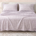 Sofia Home Textiles Printed Bedsheets - Sofia Lines Printed Double Flat Bedsheet Set 4 Pcs (240 × 260 cm) in Purple spread on a double bed - مفروشات صوفيا - ملايات مطبوعة - طقم ملاية صوفيا خطوط دبل مسطحة 4 قطع (240 × 260 سم) باللون بنفسجي مفروش على سرير دبل