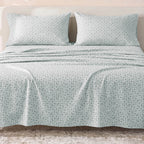 Sofia Home Textiles Printed Bedsheets - Sofia Geometric Flowers Printed Double Flat Bedsheet Set 4 Pcs (240 × 260 cm) in Light Blue spread on a double bed - مفروشات صوفيا - ملايات مطبوعة - طقم ملاية صوفيا ورد هندسي دبل مسطحة 4 قطع (240 × 260 سم) باللون أزرق فاتح مفروش على سرير دبل