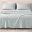 Sofia Home Textiles Printed Bedsheets - Sofia Geometric Flowers Printed Double Flat Bedsheet Set 4 Pcs (240 × 260 cm) in Light Blue spread on a double bed - مفروشات صوفيا - ملايات مطبوعة - طقم ملاية صوفيا ورد هندسي دبل مسطحة 4 قطع (240 × 260 سم) باللون أزرق فاتح مفروش على سرير دبل