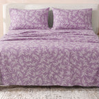 Sofia Home Textiles Printed Bedsheets - Sofia Leaves Printed Double Flat Bedsheet Set 4 Pcs (240 × 260 cm) in Purple spread on a double bed - مفروشات صوفيا - ملايات مطبوعة - طقم ملاية صوفيا ورق شجر دبل مسطحة 4 قطع (240 × 260 سم) باللون بنفسجي مفروش على سرير دبل