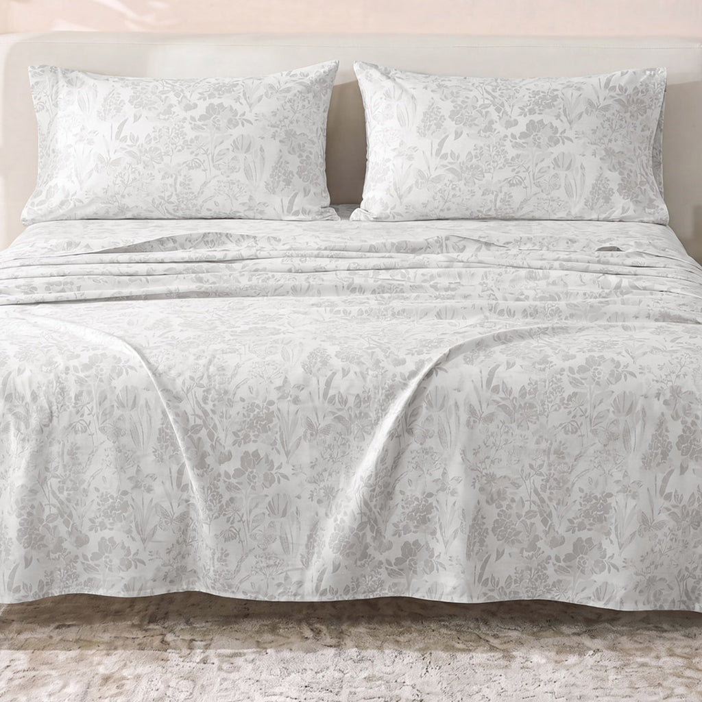 Sofia Home Textiles Printed Bedsheets - Sofia Flowers Printed Double Flat Bedsheet Set 4 Pcs (240 × 260 cm) in Grey spread on a double bed - مفروشات صوفيا - ملايات مطبوعة - طقم ملاية صوفيا ورد دبل مسطحة 4 قطع (240 × 260 سم) باللون رمادي مفروش على سرير دبل