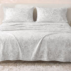 Sofia Home Textiles Printed Bedsheets - Sofia Flowers Printed Double Flat Bedsheet Set 4 Pcs (240 × 260 cm) in Grey spread on a double bed - مفروشات صوفيا - ملايات مطبوعة - طقم ملاية صوفيا ورد دبل مسطحة 4 قطع (240 × 260 سم) باللون رمادي مفروش على سرير دبل