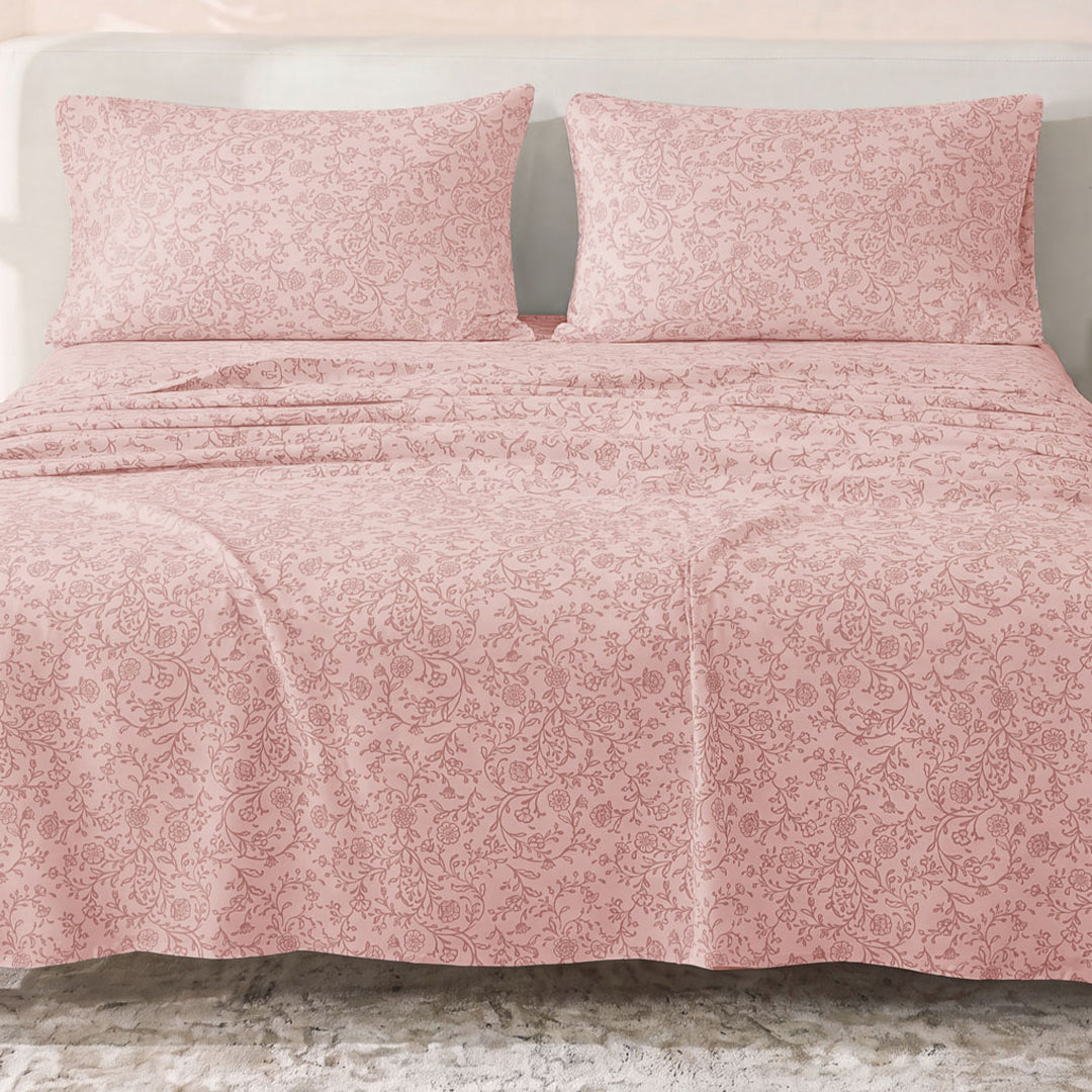 Sofia Home Textiles Printed Bedsheets - Sofia Floral Branches Printed Double Flat Bedsheet Set 4 Pcs (240 × 260 cm) in Rose spread on a double bed - مفروشات صوفيا - ملايات مطبوعة - طقم ملاية صوفيا فروع ورد دبل مسطحة 4 قطع (240 × 260 سم) باللون وردي مفروش على سرير دبل