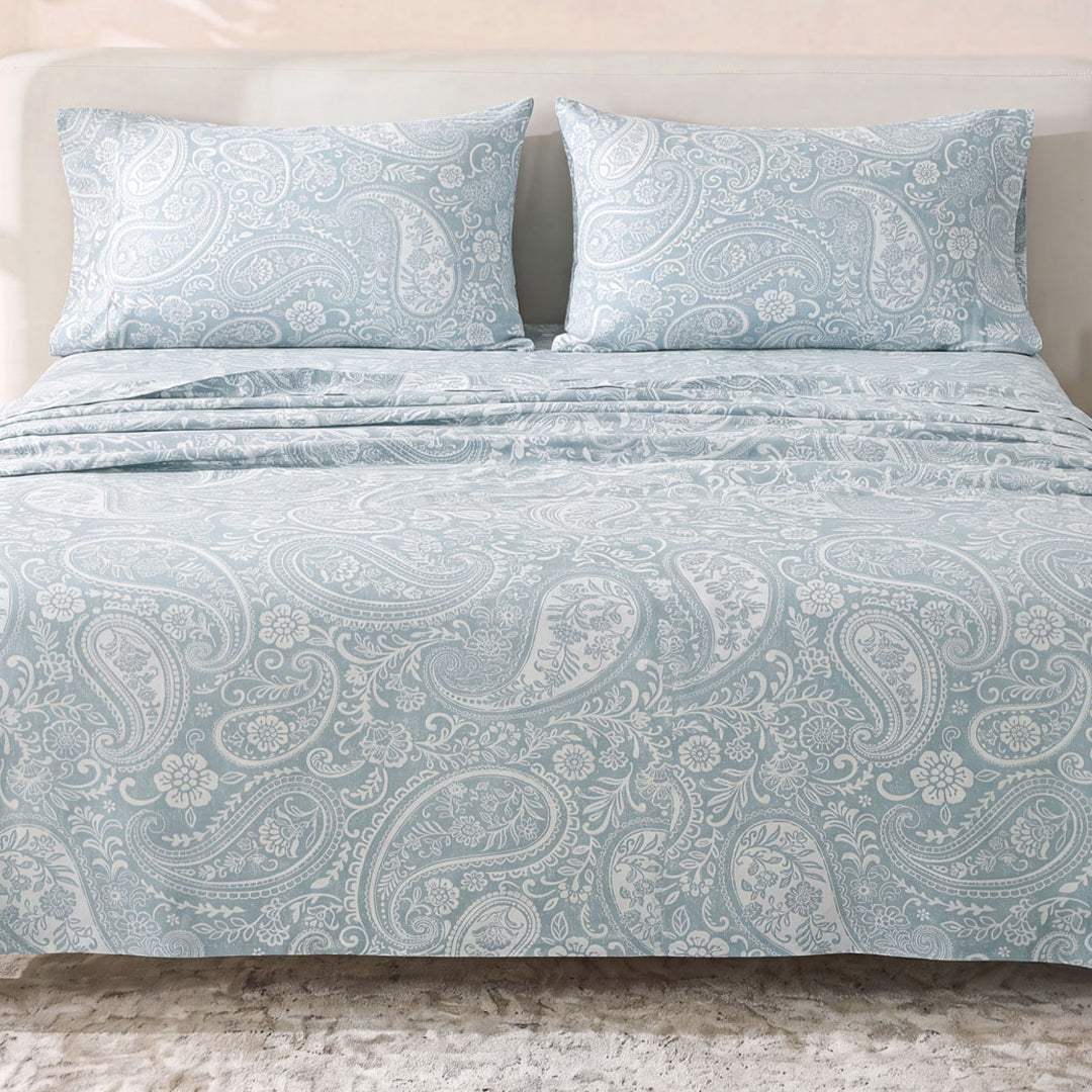 Sofia Home Textiles Printed Bedsheets - Sofia Large Paisley Printed Double Flat Bedsheet Set 4 Pcs (240 × 260 cm) in Light Blue spread on a double bed - مفروشات صوفيا - ملايات مطبوعة - طقم ملاية صوفيا كشمير كبير دبل مسطحة 4 قطع (240 × 260 سم) باللون أزرق فاتح مفروش على سرير دبل