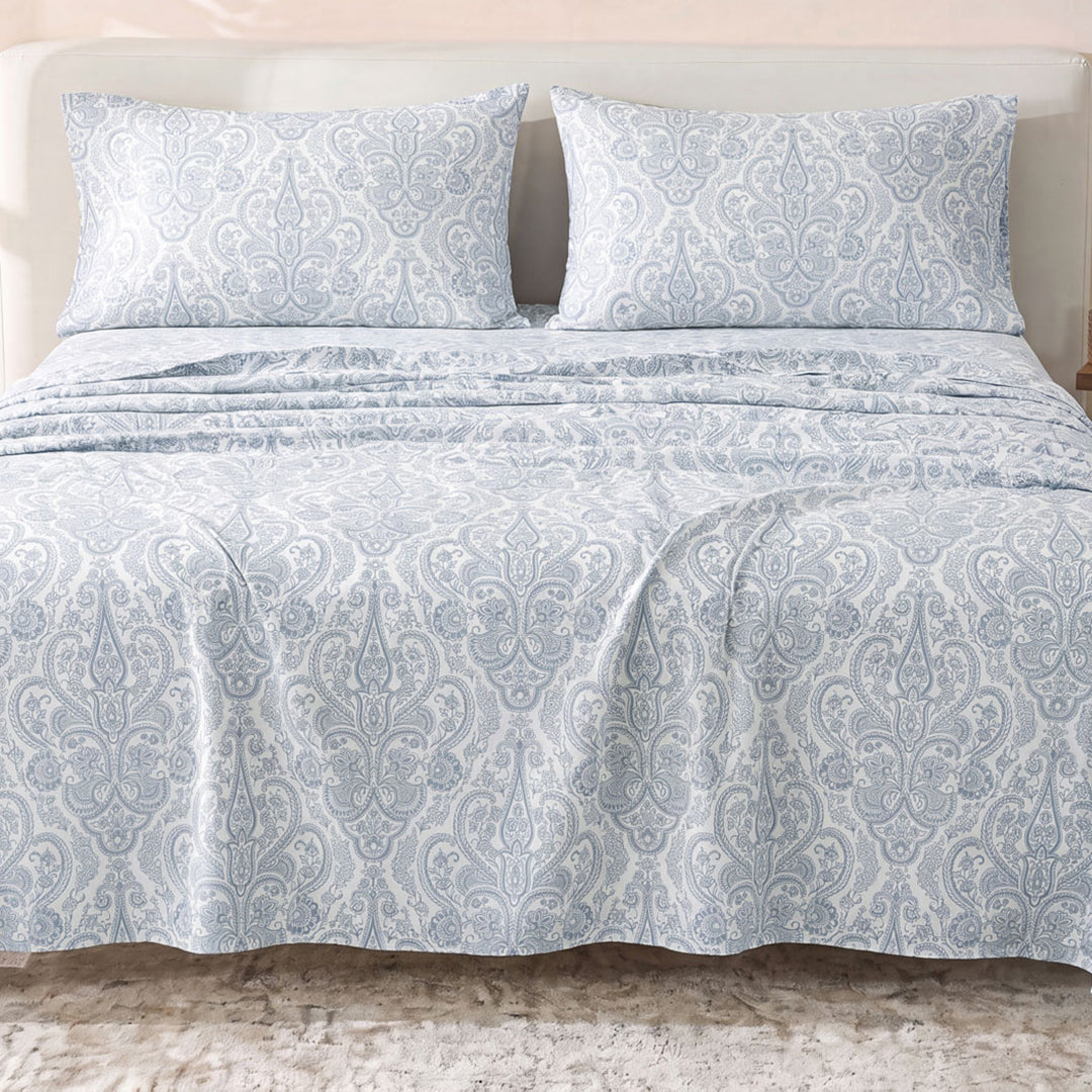 Sofia Home Textiles Printed Bedsheets - Sofia Small Paisley Printed Double Flat Bedsheet Set 4 Pcs (240 × 260 cm) in Light Blue spread on a double bed - مفروشات صوفيا - ملايات مطبوعة - طقم ملاية صوفيا كشمير صغير دبل مسطحة 4 قطع (240 × 260 سم) باللون أزرق فاتح مفروش على سرير دبل
