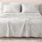 Sofia Home Textiles Printed Bedsheets - Sofia Small Paisley Printed Double Flat Bedsheet Set 4 Pcs (240 × 260 cm) in Grey spread on a double bed - مفروشات صوفيا - ملايات مطبوعة - طقم ملاية صوفيا كشمير صغير دبل مسطحة 4 قطع (240 × 260 سم) باللون رمادي مفروش على سرير دبل