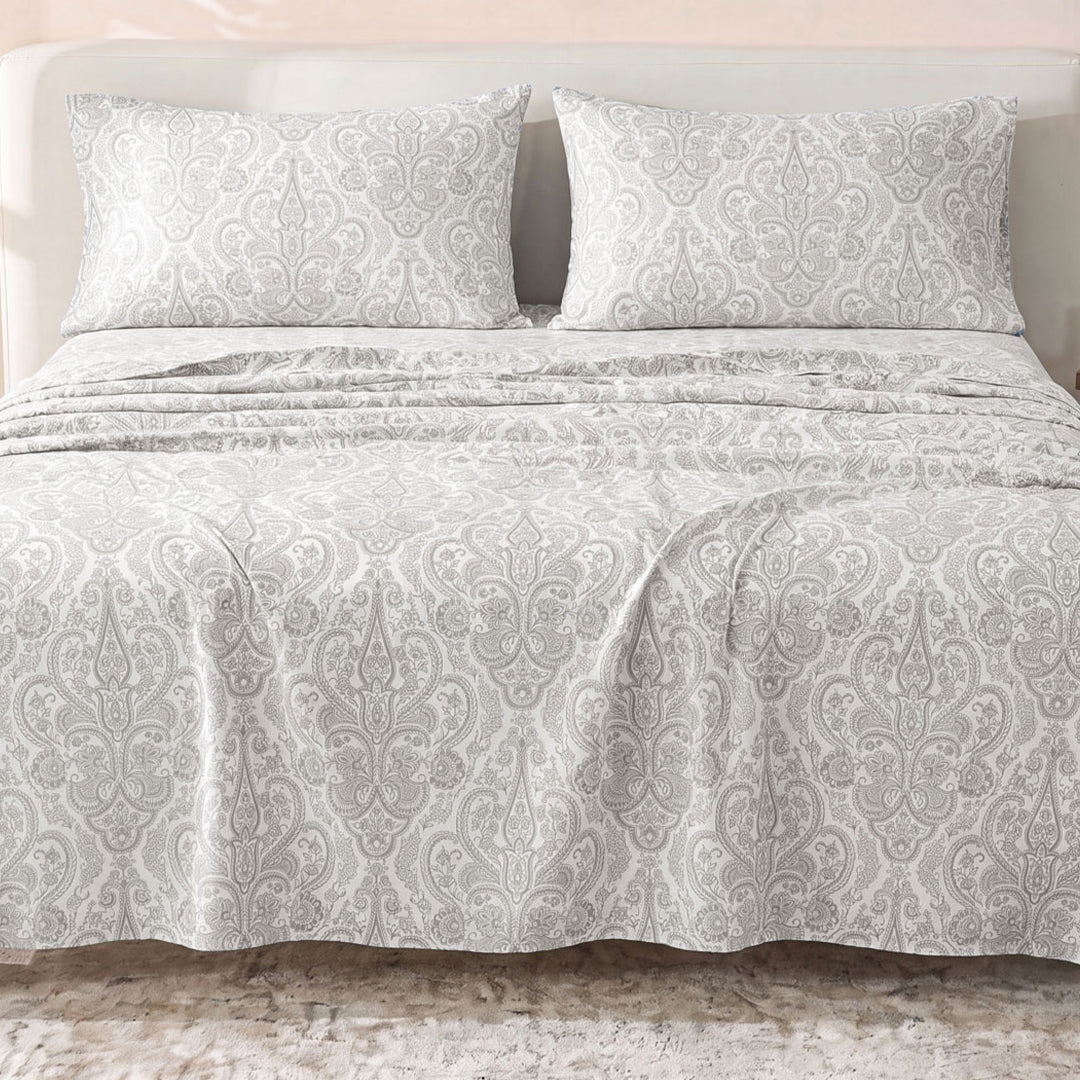Sofia Home Textiles Printed Bedsheets - Sofia Small Paisley Printed Double Flat Bedsheet Set 4 Pcs (240 × 260 cm) in Grey spread on a double bed - مفروشات صوفيا - ملايات مطبوعة - طقم ملاية صوفيا كشمير صغير دبل مسطحة 4 قطع (240 × 260 سم) باللون رمادي مفروش على سرير دبل