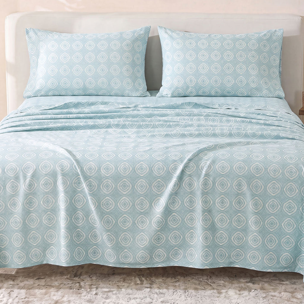 Sofia Home Textiles Printed Bedsheets - Sofia Circles Printed Double Flat Bedsheet Set 4 Pcs (240 × 260 cm) in Teal spread on a double bed - مفروشات صوفيا - ملايات مطبوعة - طقم ملاية صوفيا دوائر دبل مسطحة 4 قطع (240 × 260 سم) باللون جنزاري مفروش على سرير دبل