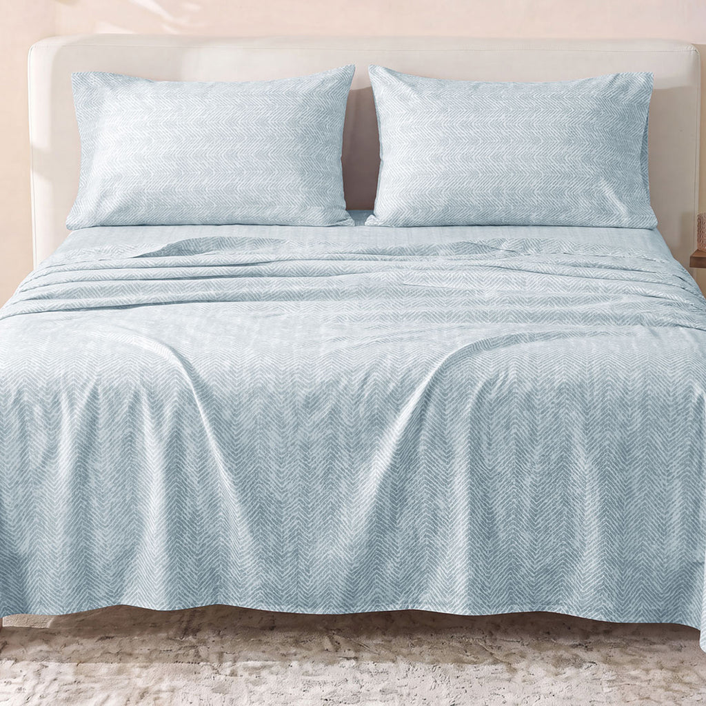 Sofia Home Textiles Printed Bedsheets - Sofia Small Zigzag Printed Double Flat Bedsheet Set 4 Pcs (240 × 260 cm) in Light Blue spread on a double bed - مفروشات صوفيا - ملايات مطبوعة - طقم ملاية صوفيا زجزاج صغير دبل مسطحة 4 قطع (240 × 260 سم) باللون أزرق فاتح مفروش على سرير دبل