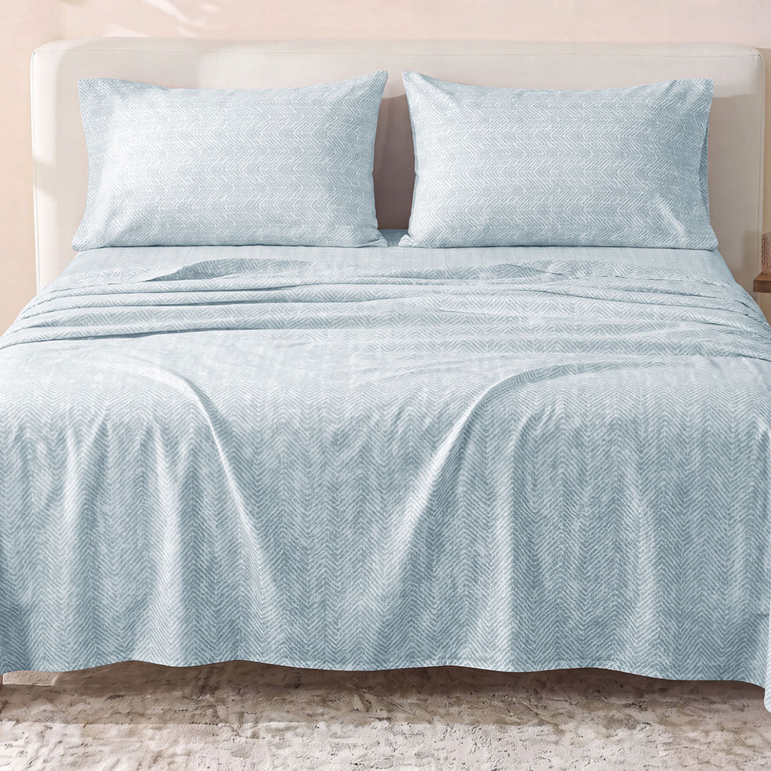 Sofia Home Textiles Printed Bedsheets - Sofia Small Zigzag Printed Double Flat Bedsheet Set 4 Pcs (240 × 260 cm) in Light Blue spread on a double bed - مفروشات صوفيا - ملايات مطبوعة - طقم ملاية صوفيا زجزاج صغير دبل مسطحة 4 قطع (240 × 260 سم) باللون أزرق فاتح مفروش على سرير دبل