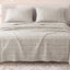 Sofia Home Textiles Printed Bedsheets - Sofia Small Checks Printed Double Flat Bedsheet Set 4 Pcs (240 × 260 cm) in Beige spread on a double bed - مفروشات صوفيا - ملايات مطبوعة - طقم ملاية صوفيا مربعات صغيرة دبل مسطحة 4 قطع (240 × 260 سم) باللون بيج مفروش على سرير دبل