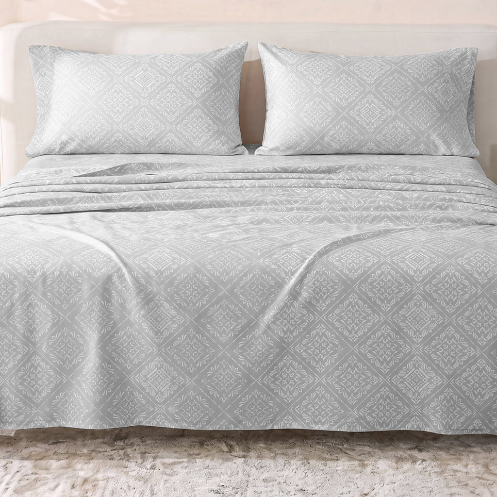 Sofia Home Textiles Printed Bedsheets - Sofia Flower Squares Printed Double Flat Bedsheet Set 4 Pcs (240 × 260 cm) in Grey spread on a double bed - مفروشات صوفيا - ملايات مطبوعة - طقم ملاية صوفيا مربعات ورد دبل مسطحة 4 قطع (240 × 260 سم) باللون رمادي مفروش على سرير دبل