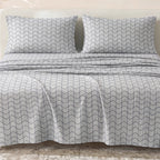 Sofia Home Textiles Printed Bedsheets - Sofia Large Zigzag Printed Double Flat Bedsheet Set 4 Pcs (240 × 260 cm) in Grey spread on a double bed - مفروشات صوفيا - ملايات مطبوعة - طقم ملاية صوفيا زجزاج كبير دبل مسطحة 4 قطع (240 × 260 سم) باللون رمادي مفروش على سرير دبل