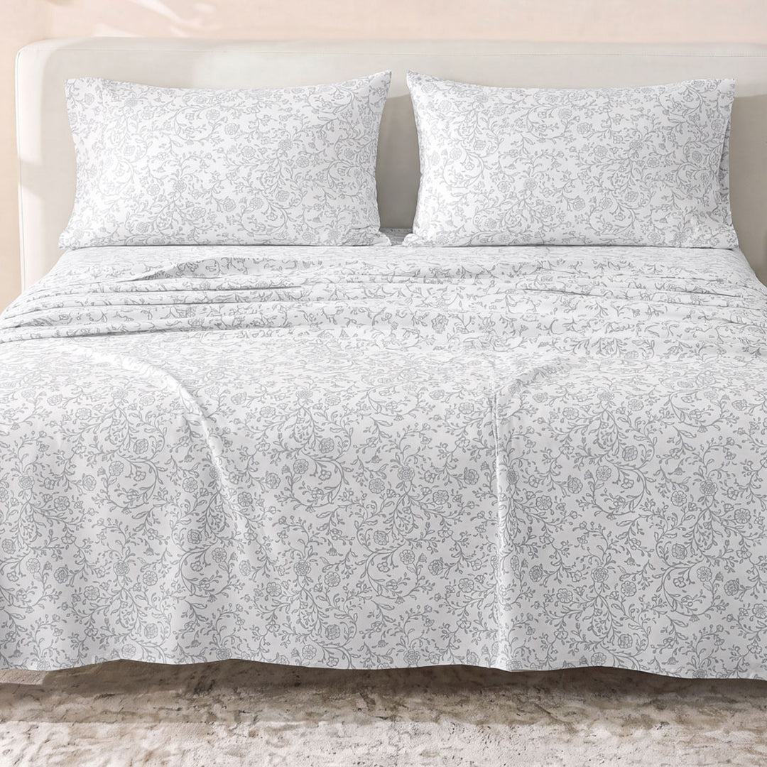 Sofia Home Textiles Printed Bedsheets - Sofia Floral Branches Printed Double Flat Bedsheet Set 4 Pcs (240 × 260 cm) in Grey spread on a double bed - مفروشات صوفيا - ملايات مطبوعة - طقم ملاية صوفيا فروع ورد دبل مسطحة 4 قطع (240 × 260 سم) باللون رمادي مفروش على سرير دبل الصورة الرئيسية