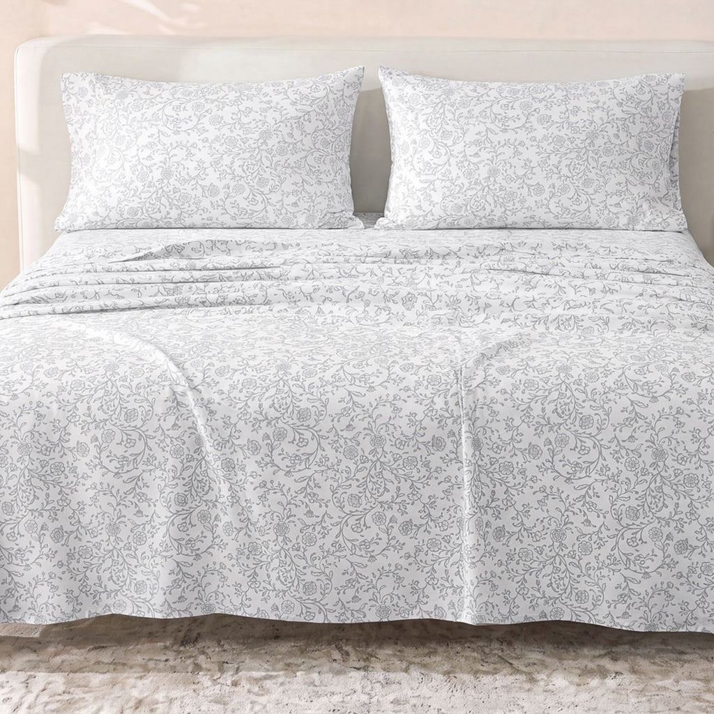 Sofia Home Textiles Printed Bedsheets - Sofia Floral Branches Printed Double Flat Bedsheet Set 4 Pcs (240 × 260 cm) in Grey spread on a double bed - مفروشات صوفيا - ملايات مطبوعة - طقم ملاية صوفيا فروع ورد دبل مسطحة 4 قطع (240 × 260 سم) باللون رمادي مفروش على سرير دبل