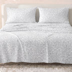Sofia Home Textiles Printed Bedsheets - Sofia Floral Branches Printed Double Flat Bedsheet Set 4 Pcs (240 × 260 cm) in Grey spread on a double bed - مفروشات صوفيا - ملايات مطبوعة - طقم ملاية صوفيا فروع ورد دبل مسطحة 4 قطع (240 × 260 سم) باللون رمادي مفروش على سرير دبل