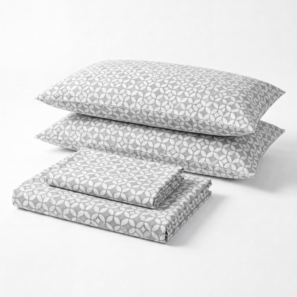 Sofia Home Textiles Printed Bedsheets - Sofia Geometric Flowers Printed Double Flat Bedsheet Set 4 Pcs in Dark Grey folded full set on a white background - مفروشات صوفيا - ملايات مطبوعة - طقم ملاية صوفيا ورد هندسي دبل مسطحة 4 قطع باللون رمادي غامق مطوي كامل على خلفية بيضاء