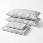Sofia Home Textiles Printed Bedsheets - Sofia Geometric Flowers Printed Double Flat Bedsheet Set 4 Pcs in Dark Grey folded full set on a white background - مفروشات صوفيا - ملايات مطبوعة - طقم ملاية صوفيا ورد هندسي دبل مسطحة 4 قطع باللون رمادي غامق مطوي كامل على خلفية بيضاء