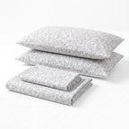 Sofia Home Textiles Printed Bedsheets - Sofia Floral Branches Printed Double Flat Bedsheet Set 4 Pcs in Grey folded full set on a white background- مفروشات صوفيا - ملايات مطبوعة - طقم ملاية صوفيا فروع ورد دبل مسطحة 4 قطع باللون رمادي مطوي كامل على خلفية بيضاء