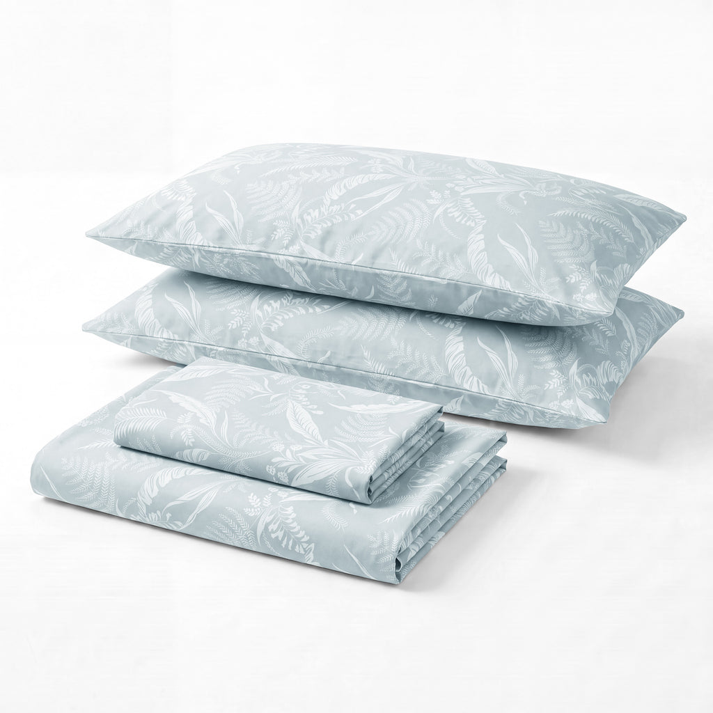 Sofia Home Textiles Printed Bedsheets - Sofia Tree Branches Printed Double Flat Bedsheet Set 4 Pcs in Light Blue folded full set on a white background - مفروشات صوفيا - ملايات مطبوعة - طقم ملاية صوفيا فروع شجر دبل مسطحة 4 قطع باللون أزرق فاتح مطوي كامل على خلفية بيضاء