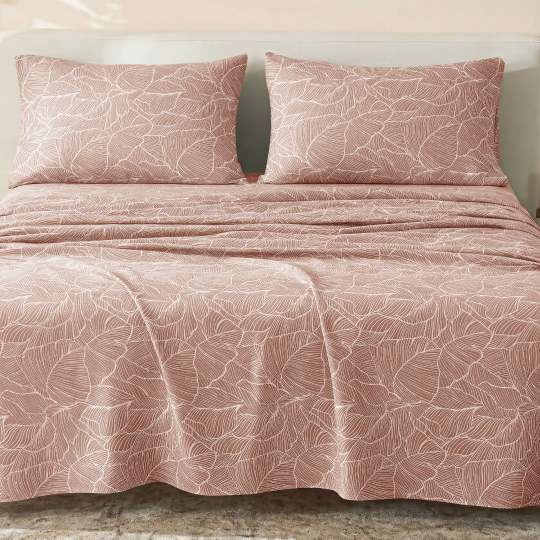Sofia Home Textiles Printed Bedsheets - Sofia Large Leaves Printed Double Flat Bedsheet Set 4 Pcs (240 × 260 cm) in Rose spread on a double bed - مفروشات صوفيا - ملايات مطبوعة - طقم ملاية صوفيا ورق شجر كبير دبل مسطحة 4 قطع (240 × 260 سم) باللون وردي مفروش على سرير دبل