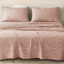 Sofia Home Textiles Printed Bedsheets - Sofia Large Leaves Printed Double Flat Bedsheet Set 4 Pcs (240 × 260 cm) in Rose spread on a double bed - مفروشات صوفيا - ملايات مطبوعة - طقم ملاية صوفيا ورق شجر كبير دبل مسطحة 4 قطع (240 × 260 سم) باللون وردي مفروش على سرير دبل