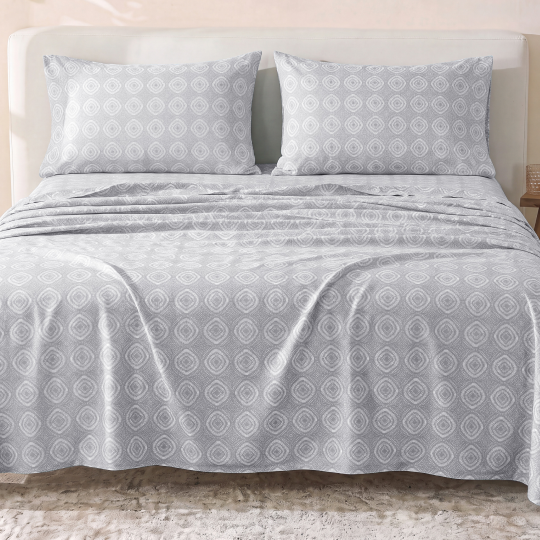 Sofia Home Textiles Printed Bedsheets - Sofia Circles Printed Double Flat Bedsheet Set 4 Pcs (240 × 260 cm) in Grey spread on a double bed - مفروشات صوفيا - ملايات مطبوعة - طقم ملاية صوفيا دوائر دبل مسطحة 4 قطع (240 × 260 سم) باللون رمادي مفروش على سرير دبل