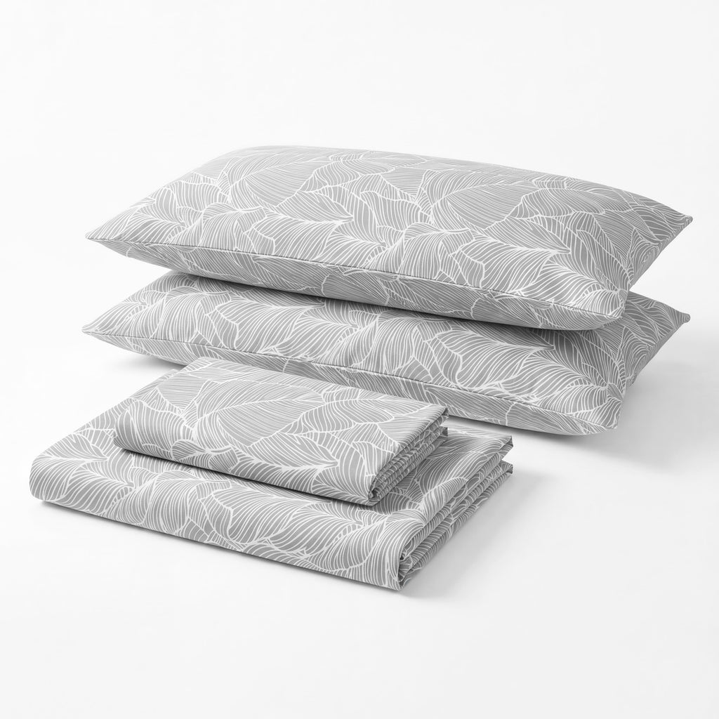 Sofia Home Textiles Printed Bedsheets - Sofia Large Leaves Printed Double Flat Bedsheet Set 4 Pcs in Grey folded full set on a white background - مفروشات صوفيا - ملايات مطبوعة - طقم ملاية صوفيا ورق شجر كبير دبل مسطحة 4 قطع باللون رمادي مطوي كامل على خلفية بيضاء